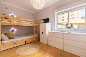 Ένα ή περισσότερα κρεβάτια σε δωμάτιο στο Real Oeiras Residence