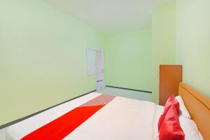 Galeriebild der Unterkunft OYO 91351 87 Guest House in Balian