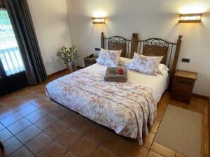 Cama o camas de una habitación en Hotel-Apartamento Rural Atxurra