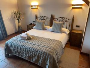 Cama o camas de una habitación en Hotel-Apartamento Rural Atxurra