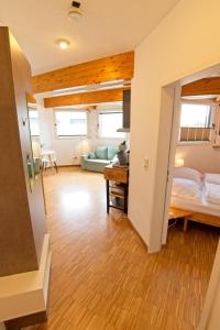 Postel nebo postele na pokoji v ubytování Boardinghouse Steinen