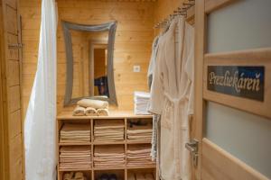 a bathroom with a mirror and towels in a cabin at Miracle Seasons in Liptovský Mikuláš +47 photos