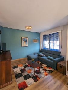 a living room with a couch and a table at Maison Alice in Saint Vincent +57 photos