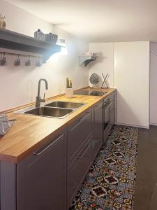 a kitchen with a sink and a counter at Casa Magica Ogliastro in San Marco di Castellabate
