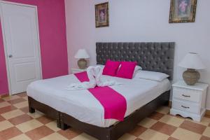 Postel nebo postele na pokoji v ubytování OYO Hotel Marías,Aeropuerto Internacional de Chetumal