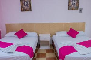 Postel nebo postele na pokoji v ubytování OYO Hotel Marías,Aeropuerto Internacional de Chetumal + 37 fotografií