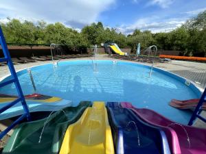 a pool with a water park with slides at Stary Mlyn in Yabluniv +273 photos