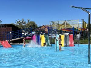 a group of people playing in a water park at Stary Mlyn in Yabluniv