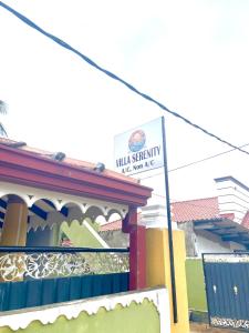 a sign on the side of a building at Villa Serenity in Negombo