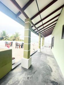 a patio with a view of the beach at Villa Serenity in Negombo