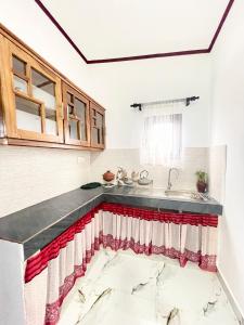 a kitchen with a marble counter top and a sink at Villa Serenity in Negombo
