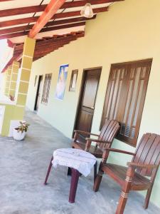 two chairs sitting on the porch of a house at Villa Serenity in Negombo