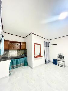 a living room with a white ceiling and a mirror at Villa Serenity in Negombo +37 photos