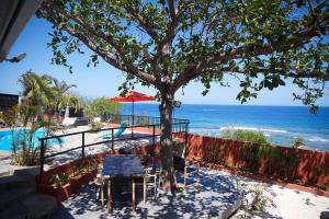 a view of the beach from a resort at Villa Vue-Belle in Saint-Paul