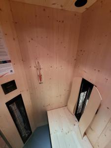 an inside view of a room with a chair in it at Komfort Appartement Royal Windberger in Schladming