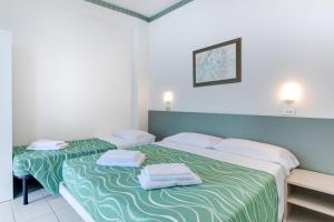 Postel nebo postele na pokoji v ubytování Hotel Internazionale