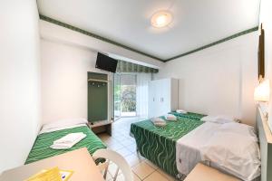 Postel nebo postele na pokoji v ubytování Hotel Internazionale