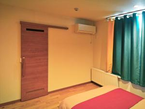 Postel nebo postele na pokoji v ubytování White House Guesthouse