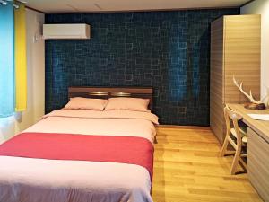 Postel nebo postele na pokoji v ubytování White House Guesthouse