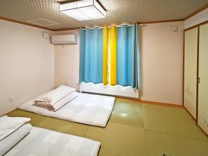 Postel nebo postele na pokoji v ubytování White House Guesthouse