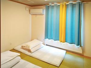 Postel nebo postele na pokoji v ubytování White House Guesthouse