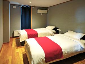 Postel nebo postele na pokoji v ubytování White House Guesthouse