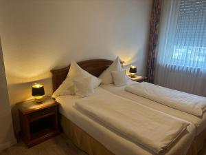 Postel nebo postele na pokoji v ubytování Hotel Mietz