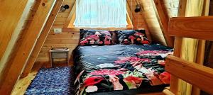 a bed in a small room in a cabin at M&K chalets in Žabljak