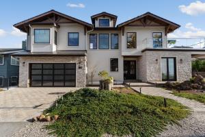 a large house with a garage at Ocean Whispers home in Moss Beach