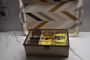 a wooden box with a tea shop sign in it at Niki's cozy apartment in Mytilene