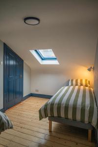 A bed or beds in a room at Otter Hostel Connemara