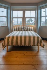 A bed or beds in a room at Otter Hostel Connemara