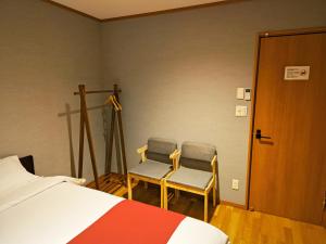 Postel nebo postele na pokoji v ubytování White House Guesthouse