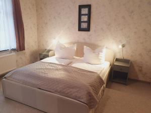 En eller flere senge i et værelse på Harzhaus am Brunnen