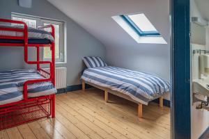 A bed or beds in a room at Otter Hostel Connemara