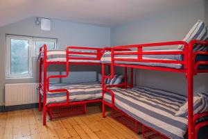A bed or beds in a room at Otter Hostel Connemara