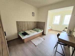 Postel nebo postele na pokoji v ubytování Danubius Szálló
