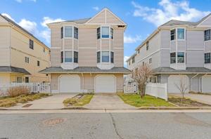 a large house with a driveway in front of it at Chic Haven- Close to Beach, Boardwalk & Casinos in Atlantic City