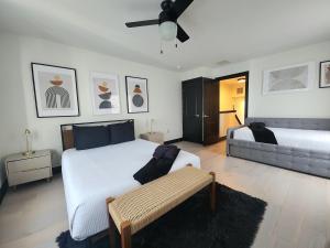 a bedroom with two beds and a ceiling fan at Chic Haven- Close to Beach, Boardwalk & Casinos in Atlantic City