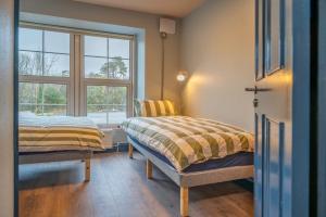 A bed or beds in a room at Otter Hostel Connemara