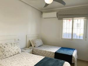 Postel nebo postele na pokoji v ubytování Villa Oasis Esperanza Camposol Sector D + 11 fotografií