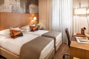 Postel nebo postele na pokoji v ubytování Starhotels Ritz