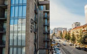 a view of a building with cars parked on a street at Hotel CH51 in Batumi