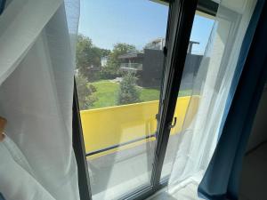 a view of a window with a view of a building at Otopeni Studio C2 4 Airport Therme in Otopeni