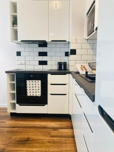 Η κουζίνα ή μικρή κουζίνα στο Apartament Square space