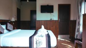 Katil atau katil-katil dalam bilik di Hotel Yechu