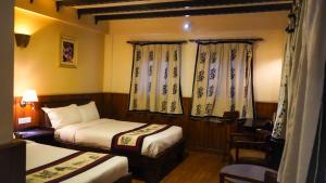 Katil atau katil-katil dalam bilik di Hotel Yechu