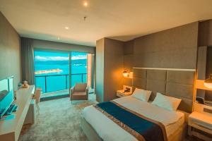Ένα ή περισσότερα κρεβάτια σε δωμάτιο στο Royal Comfort Hotel