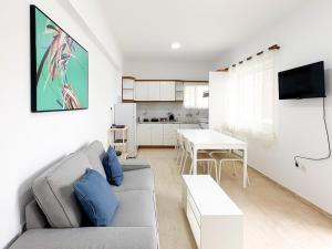 a living room with a couch and a table at Filio's home in Zárakes