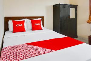 Rúm í herbergi á OYO Life 91569 Omah Wijaya Kusuma Syariah